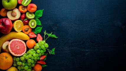 Set of fresh fruits. Healthy food. On Wooden background. Top view. Free space.