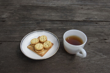 Tea cup with cookies.