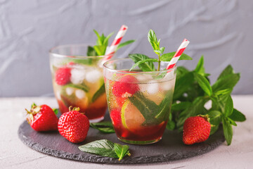 Cold lemonade with fresh strawberry, mint, lime and jam