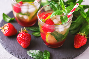 Cold lemonade with fresh strawberry, mint, lime and jam