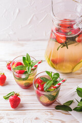 Cold lemonade with fresh strawberry, mint, lime and jam