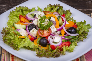 Fresh vegetable greek salad on the table