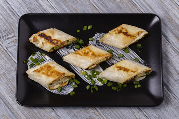 Pita bread wrapped with cottage cheese and vegetables