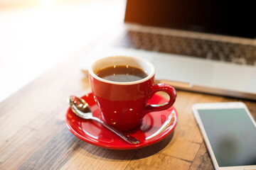 laptop and black coffe in vintage tone