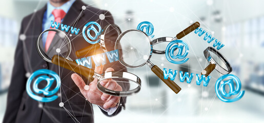 Businessman touching 3D rendering contact icon and magnifying glass in his hand