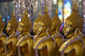 UTHAI THANI PROVINCE, THAILAND - August, 2016: Golden Buddha statue at Cathedral glass, Wat Tha...