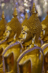 UTHAI THANI PROVINCE, THAILAND - August, 2016: Golden Buddha statue at Cathedral glass, Wat Tha Sung or Wat Chantharam