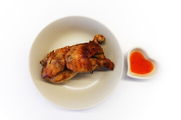 Grilled chicken with sweet and spicy sauce on white background