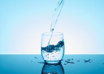 Creative splashing water in the glass