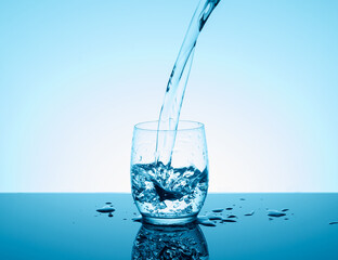 Creative splashing water in the glass