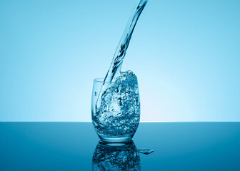 Creative splashing water in the glass