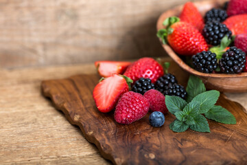 Berries on wooden cutting board