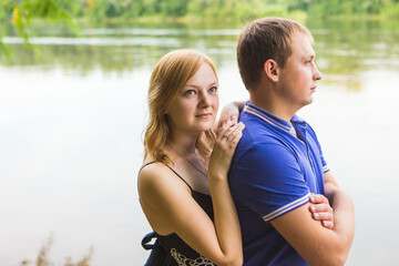 Romantic young couple in love relaxing outdoors in park