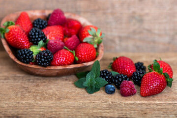 Berries on wooden dish