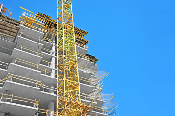 Crane and highrise construction site
