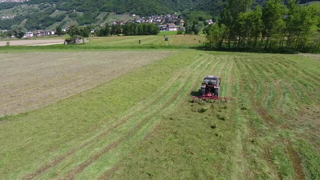 Grass mowing with a tractors - Valtellina