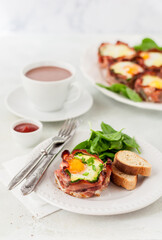 Fototapeta na wymiar Bacon and Egg Cups with Spinach
