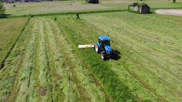 Agricultural machines - Tractors in the fields - Grass cutting in Valtellina