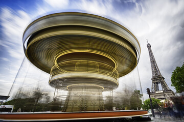 Landscape photo of Eiffel Tower with running carousel