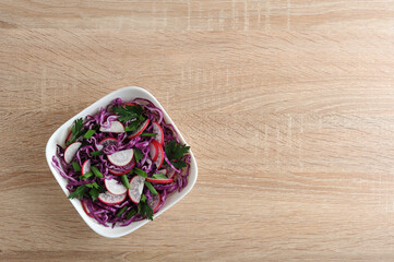 vegetarian menu - salad of cabbage and radish in the bowl