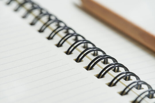 Close up notebook with pencil 