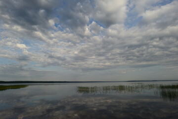 Morning calm on a lake with a mirror water surface