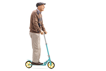 Obraz premium Senior riding a scooter