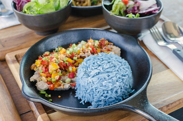 Food healthy, garlic pork with blue rice, blue color made from butterfly pea (Blue Pea).