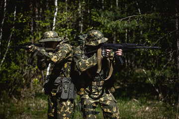 Military men with submachine gun