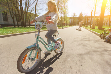 Girl on bicycle in day