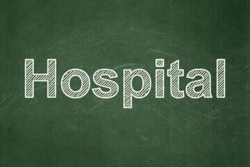 Fototapeta premium Healthcare concept: Hospital on chalkboard background