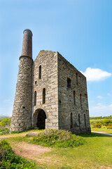 Fototapeta na wymiar The pumping engine at Pascoe's Shaft, South Wheal France, Treskillard, Redruth, Cornwall, UK. Built in 1881, the building housed a 80 inch cylinder engine for pumping water from the mine workings.