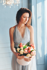 girl with bouquet roses, received as a gift