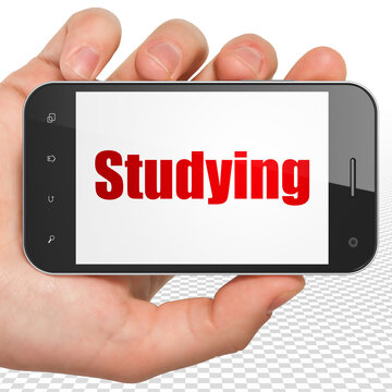 Studying concept: Hand Holding Smartphone with Studying on display