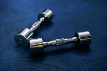 Select focus Dumbbell on floor in gym