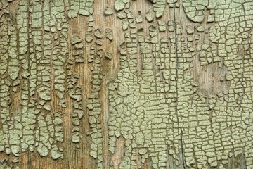 Cracked painting on wooden surface