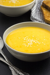 Vegan split pea soup on a dark background.  