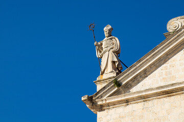 Obraz premium Statue on St. Nikola church in town Prcanj, Kotor Bay, Montenegro