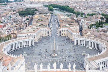 Fototapeta na wymiar Saint Peter's Square, the large plaza in front of St. Peter's Basilica in Vatican City with the aerial view of Rome, Italy.