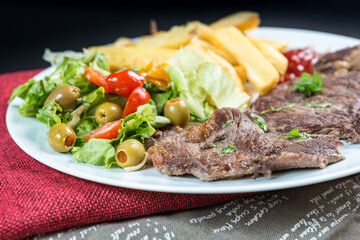 juicy steak beef meat with tomato and french fries