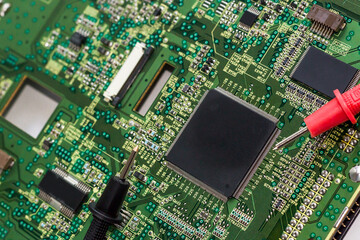 repairing computer components in service center. Repairing and fixing service in lab. Electronics repair service concept. Multimeter and microcircuit