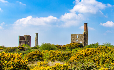 Cook's Kitchen Mine near Pool, Cornwall, UK. The pumping house is to the left and the Winding Engine House to the right