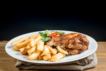 fried chicken and golden French fries potatoes