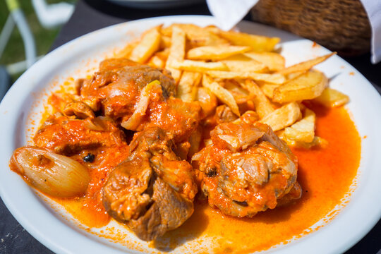 Stifado with fries on the plate. Greek dish