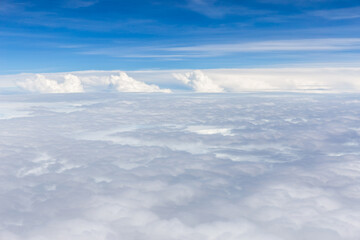Fototapeta na wymiar Beautiful fluffy white cumulus clouds on blue sky background.