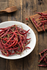 Red Dried Chillies or Dry chillies on wood

