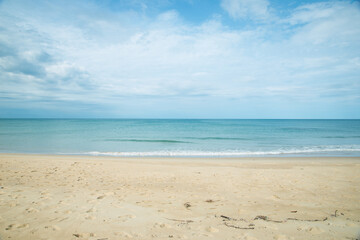 Fototapeta na wymiar Beautiful sand beach with cloudy sky background