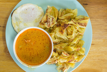 Crispy roti with curry chicken, kind of Indian food made of flour