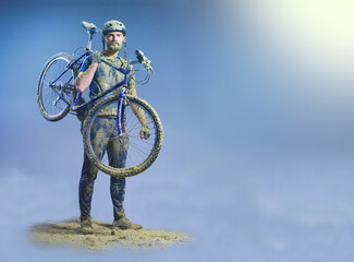 The man with bike in sand standing on abstract background. Collage