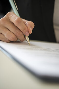 Woman signing contract